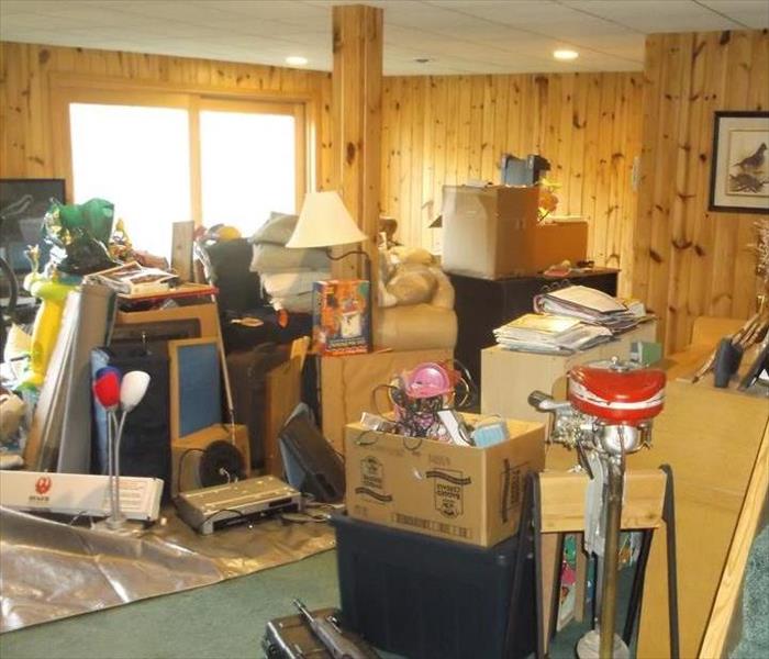 Picture of family room filled with contents due to a septic line blockage.
