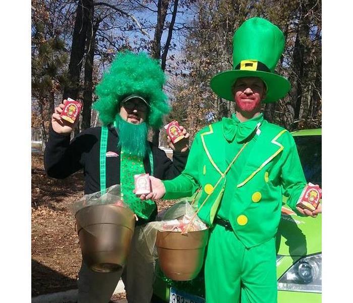 Two gentleman dressed in St. Patrick's Day costumes/