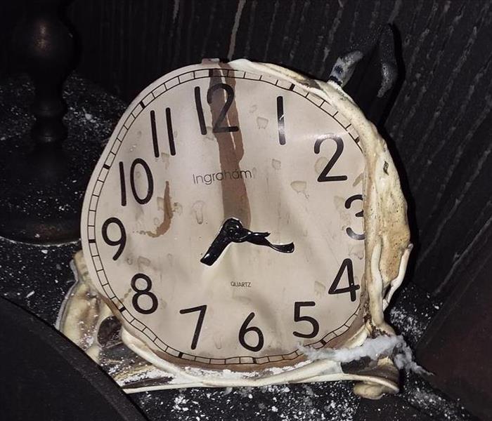 Melted clock as the result of a house fire in Outing, MN