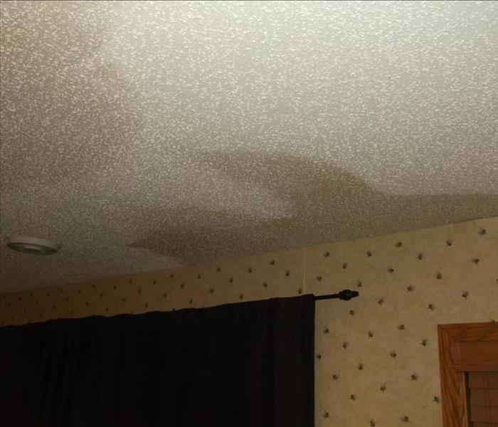 After a storm, pictures shows water staining on ceiling.