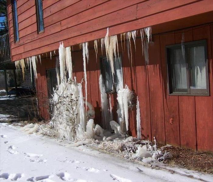 Icicles on house from broken pipes.